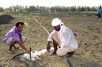 Two farmers working to get groundwater from the Sanaa Basin.