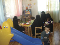 Mother and children together at the Al-Marah Club.