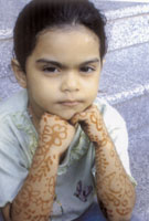 Adani girl shows off the Henna on her arms.