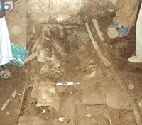 Bronze vases were found next to the coffin. Many had been shattered to pieces by reckless locals.