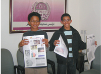Fares (left) and Mohammed proudly show off their work.