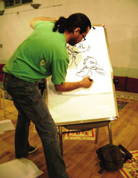 Angoulme International Comic Book Festival award-winner Fabien Rypert demonstrates to students how to draw a comic strip.