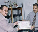 Taiz Bureau Chief gives certificate of honor to  Al-Dobaee, Marketing Manager of the National Dairy and Food Company
