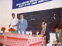 Dr. Hussein al-Bakry, Dean, addresses the assembly while Dr. Abdullah Al-Bar, Vice Dean, looks on