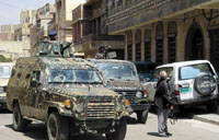 Armored vehicles and heavy security around the court where the sentence was made.<br>YT photos by M. Al-Qadhi’/><figcaption>Armored vehicles and heavy security around the court where the sentence was made.<br>YT photos by M. Al-Qadhi</figcaption></figure></div></td></tr></table><b><i>Mohammed Al-Qadhi</i></b><br>On Saturday, the Sana'a Criminal Court concerned with terrorism, sentenced one al-Qaeda militant to death, while 14 others received prison terms of between 3 to 10 years, having been found guilty of forming an armed group and carrying out attacks on Yemeni and Western targets.  The court run by Judge Ahmad al-Jermozi sentenced Hizam Mujali to death for killing a security man named Hamid Khasroof at a security checkpoint. <br>Five other al-Qaeda supporters, namely They were: Omar Saeed Hasan Jarallah, Fawzi al-Wajeeh, Mohammed Saeed Ali al-Amari, Fawzi Yahia al-Hababi, and Yasser Ali Salem (tried in absentia), received sentences of 10 years for bombing the French supertanker Limburg.<br>The judge, while reading the verdict, said these defendants were found guilty of participating in the October 2002 bombing of the Limburg oil tanker, which killed a Bulgarian crew member and spilled 90,000 barrels of oil into the port of Mukala.<br>The two brothers Fawaz al-Rabee and Abu Bakr al-Rabee were sentenced to 10 years in jail. The conviction of Fawaz al-Rabeiee, the ring leader, included the attack on the helicopter of the US Hunt Oil company, and the detonation of explosions at a building of the civil aviation authority. Al-Rabee also was fined $100,000 to compensate the civil aviation authority for damage to the building. He also participated in the murder of Khasroof.<br>The other five militants (Ibraheem Mohammed al-Huwaidi, Aref Saleh Ali Mujali, Mohammed Abdullah al-Dailami, Abdulghani Ali Hussein Kaifan, and Kasem Yahia al-Raimee) were sentenced to five years in prison. They were found guilty of plotting attacks against the US, French, UK, Cuban and German embassies, and plotting to assassinate former U.S. Ambassador to Yemen, Edmund Hull, as well as intelligence officials.<br>The two defendants- Khaled Ahmad al-Jalob, and Saleem Mohammed Ali al-Dailami, were sentenced to three years in prison, for falsifying documents relating to the various attacks.<br>The verdicts included that the explosives (approximately half a ton) and weapons seized with the defendants, be confiscated. <br>The defendants strongly condemned and rejected the verdict, doubting the legitimacy of the court. Upon hearing the verdict, the 13 bearded men in blue prison dress, burst into cries of “God is great, America is the enemy of God, Osama bin Laden is God's beloved” from behind the bar. The defendant Yasser Ali Salem was tried in absentia, while Saleem Mohammed Ali al-Dailami was absent from the pronouncement of the verdict due to his sickness. All the defendants and their relatives appealed the verdicts.<br>The judge said while reading the verdict, that Abdulraheem al-Nashiri, first prime suspect of the USS Cole bombing (currently in the US custody), paid $40,000 to fund the Limburg attack. The explosives were bought by the former al-Qaeda leader Abu Ali al-Harithi and were transported from his house in Shabwa to Mukalla in Hadramut. Al-Harithi was killed by the CIA with a missile fired from a drone aircraft later in 2002.<br>Relatives of the defendants who were present in the courtroom condemned the verdicts, describing them as political. The courtroom saw hustle and bustle as the crowd of the defendants' relatives gathered around the bar, furiously criticizing the court. Father of defendant Abdulkareem Kaifan told Yemen Times “the verdict was already decided and the tribunal was just a decoration to pass the verdict.” While Saleh Mujali, father of Hizam who received death penalty, said, “The verdict is unjust and the agents are behind it.” The father of Fawaz al-Rabee said that there is no legal basis for the verdict as the defendants did not get enough legal protection. Advocate Faiz al-Hajori who was defending al-Wajeeh said, “the court did not pay attention to the defense we presented. The verdicts were based on evidences which were proved false.”<br>However, other observers had expected heavier verdicts for some defendants like Fawaz al-Rabee, a former employee at the Presidential office, and an al-Qaeda suspect wanted by the US government. However, they said that the process of the tribunal was full of mistakes and lapses, as the 12 suspects were left without defense. Advocates named by the defendants quit the trial twice in protest against the refusal of the court to provide them with a copy of investigation documents. Even the advocates appointed by the court did the same, for the same reason, leaving the defendants without a defense, which has shed doubts over the legitimacy of the tribunal despite the fact that some defendants admitted their guilt in the first hearing held on May 29th.<br>The verdict was issued amid the heavy security measures of the final session.<br />——<br />[archive-e:768-v:13-y:2004-d:2004-08-30-p:front]							</div>
													<div class="similar-articles-block">
		<div class="articles-title-block">
			<h5 class="articles-block-title">SIMILAR ARTICLES</h5>
		</div>
		<div class="similar-articles-block-colls coll-2">
							<div>
					<article>
	<a class="article-card" href="https://yementimes.com/heavy-rains-and-earthquakes-displace-people-in-ibb-archives2010-1407-front/">
					<div class="article-card-img">
									<img width="400" height="261" src="https://eqeuyefvifz.exactdn.com/wp-content/uploads/2010/10/local1407main_1.jpg?strip=all&lossy=0&ssl=1" class="attachment-post-thumbnail size-post-thumbnail wp-post-image" alt="" decoding="async" loading="lazy" srcset="https://eqeuyefvifz.exactdn.com/wp-content/uploads/2010/10/local1407main_1.jpg?strip=all&lossy=0&ssl=1 400w, https://eqeuyefvifz.exactdn.com/wp-content/uploads/2010/10/local1407main_1-300x196.jpg?strip=all&lossy=0&ssl=1 300w" sizes="(max-width: 400px) 100vw, 400px" />															</div>
				<div class="article-card-caption">
			<h4 class="article-card-title">Heavy rains and earthquakes displace people in Ibb [Archives:2010/1407/Front]</h4>
			<p>By Ali Saeed IBB, Oct. 11 – Mohammad Nu’man, 27, in Al-Makhadr district, Ibb, and…</p>
			<div class="article-card-caption-bottom">
				<div class="article-card-author">archive</div>
				<div class="article-card-date">October 14 2010</div>
			</div>
		</div>
	</a>
</article>				</div>
							<div>
					<article>
	<a class="article-card" href="https://yementimes.com/education-key-to-maternal-and-newborn-health-archives2009-1228-front-page/">
					<div class="article-card-img">
									<img width="137" height="200" src="https://eqeuyefvifz.exactdn.com/wp-content/uploads/2009/01/front1_1-1.jpg?strip=all&lossy=0&ssl=1" class="attachment-post-thumbnail size-post-thumbnail wp-post-image" alt="" decoding="async" loading="lazy" />															</div>
				<div class="article-card-caption">
			<h4 class="article-card-title">Education key to maternal and newborn health [Archives:2009/1228/Front Page]</h4>
			<p>Salma IsmailSANA'A Jan. 25 ) Childbirth and pregnancy are generally considered times of great joy,…</p>
			<div class="article-card-caption-bottom">
				<div class="article-card-author">archive</div>
				<div class="article-card-date">January 26 2009</div>
			</div>
		</div>
	</a>
</article>				</div>
					</div>
	</div>
					</div>
					<div class="sidebar-right">
	<div class="widget widget-subscribe-form">
	<div class="articles-title-block">
		<h5 class="articles-block-title">SUBSCRIBE NOW</h5>
	</div>
	<form class="subscribe-form" method="post" action="/?na=s">
		<div class="form-group">
			<input type="hidden" name="nlang" value="">
			<input class="form-control" type="email" name="ne" placeholder="Enter your email" value="" required>
			<button type="submit" class="btn"><span>SUBSCRIBE</span></button>
		</div>
	</form>
</div>						<div class="widget">
			<div class="articles-title-block">
				<h5 class="articles-block-title">CATEGORIES</h5>
			</div>
			<div>
				<nav>
					<ul class="navbar-collapse-mnu">
													<li><a href="https://yementimes.com/category/ln/">Local News</a></li>
													<li><a href="https://yementimes.com/category/supplementary/">Supplementary</a></li>
													<li><a href="https://yementimes.com/category/press/">Press Review</a></li>
													<li><a href="https://yementimes.com/category/sports/">Sports</a></li>
													<li><a href="https://yementimes.com/category/view/">Viewpoint</a></li>
													<li><a href="https://yementimes.com/category/letters/">Letters to the Editor</a></li>
													<li><a href="https://yementimes.com/category/uncategorised/">Uncategorised</a></li>
													<li><a href="https://yementimes.com/category/law-diplomacy/">Law & Diplomacy</a></li>
													<li><a href="https://yementimes.com/category/cartoon/">Cartoon</a></li>
													<li><a href="https://yementimes.com/category/reportage/">Reportage</a></li>
													<li><a href="https://yementimes.com/category/health/">Health & Environment</a></li>
													<li><a href="https://yementimes.com/category/governance/">Governance</a></li>
													<li><a href="https://yementimes.com/category/economy/">Business & Economy</a></li>
													<li><a href="https://yementimes.com/category/science-technology/">Science & Technology</a></li>
													<li><a href="https://yementimes.com/category/culture/">Culture & Society</a></li>
													<li><a href="https://yementimes.com/category/education/">Education</a></li>
													<li><a href="https://yementimes.com/category/opinion/">Opinion</a></li>
													<li><a href="https://yementimes.com/category/archived-pdf/">Archived PDF</a></li>
													<li><a href="https://yementimes.com/category/interview/">Interview</a></li>
													<li><a href="https://yementimes.com/category/featured/">Featured</a></li>
													<li><a href="https://yementimes.com/category/community/">Community</a></li>
													<li><a href="https://yementimes.com/category/front-featured/">Front Featured</a></li>
													<li><a href="https://yementimes.com/category/front/">Front Page</a></li>
													<li><a href="https://yementimes.com/category/ln-featured/">Local News Featured</a></li>
													<li><a href="https://yementimes.com/category/focus/">Focus</a></li>
													<li><a href="https://yementimes.com/category/economy-featured/">Business & Economy Featured</a></li>
													<li><a href="https://yementimes.com/category/lastpage/">Last Page</a></li>
													<li><a href="https://yementimes.com/category/culture-featured/">Culture & Society Featured</a></li>
											</ul>
				</nav>
			</div>
		</div>
				<div class="widget">
			<div class="articles-title-block">
				<h5 class="articles-block-title">SHARE THIS ARTICLE ON</h5>
				<div><div class="addtoany_shortcode"><div class="a2a_kit a2a_kit_size_52 addtoany_list" data-a2a-url="https://yementimes.com/al-qaeda-militants-convicted-of-terrorism-archives2004-768-front-page/" data-a2a-title="Al-Qaeda militants convicted of terrorism [Archives:2004/768/Front Page]"><a class="a2a_button_twitter" href="https://www.addtoany.com/add_to/twitter?linkurl=https%3A%2F%2Fyementimes.com%2Fal-qaeda-militants-convicted-of-terrorism-archives2004-768-front-page%2F&linkname=Al-Qaeda%20militants%20convicted%20of%20terrorism%20%5BArchives%3A2004%2F768%2FFront%20Page%5D" title="Twitter" rel="nofollow noopener" target="_blank"></a><a class="a2a_button_facebook" href="https://www.addtoany.com/add_to/facebook?linkurl=https%3A%2F%2Fyementimes.com%2Fal-qaeda-militants-convicted-of-terrorism-archives2004-768-front-page%2F&linkname=Al-Qaeda%20militants%20convicted%20of%20terrorism%20%5BArchives%3A2004%2F768%2FFront%20Page%5D" title="Facebook" rel="nofollow noopener" target="_blank"></a><a class="a2a_button_linkedin" href="https://www.addtoany.com/add_to/linkedin?linkurl=https%3A%2F%2Fyementimes.com%2Fal-qaeda-militants-convicted-of-terrorism-archives2004-768-front-page%2F&linkname=Al-Qaeda%20militants%20convicted%20of%20terrorism%20%5BArchives%3A2004%2F768%2FFront%20Page%5D" title="LinkedIn" rel="nofollow noopener" target="_blank"></a></div></div></div>
			</div>
		</div>
	</div>
				</div>				
			</div>
		</section>
	</main>
<footer class="main-foot">
	<div class="container">
		<div class="navbar-foot">
							<div class="navbar-foot-logo-block">
					<div class="navbar-foot-logo">
						<a href="https://yementimes.com">
							<img src="https://eqeuyefvifz.exactdn.com/wp-content/uploads/2023/02/yemens.png?strip=all&lossy=0&ssl=1" alt="yemens">
						</a>
					</div>
				</div>
						<div class="foot-menu-wrap coll-4">
				<div>
											<div class="foot-title">Footer</div>
						<nav>
							<ul id="menu-footer" class="foot-menu coll-2"><li id="menu-item-103253" class="menu-item menu-item-type-post_type menu-item-object-page menu-item-103253"><a href="https://yementimes.com/contact/">Contact Us</a></li>
<li id="menu-item-103254" class="menu-item menu-item-type-post_type menu-item-object-page menu-item-103254"><a href="https://yementimes.com/about/">About Us</a></li>
</ul>						</nav>
									</div>
				<div>
											<div class="foot-title">Quicklinks</div>
						<nav>
							<ul id="menu-quicklinks" class="foot-menu"><li id="menu-item-273" class="menu-item menu-item-type-post_type menu-item-object-page menu-item-273"><a href="https://yementimes.com/archive/">Archive</a></li>
</ul>						</nav>
									</div>
				<div>
											<div class="foot-title">Follow Us</div>
																<nav>
							<ul class="social-menu">
																	<li><a href="https://twitter.com/theyementimes" target="_blank"><?xml version="1.0" encoding="UTF-8"?> <svg xmlns="http://www.w3.org/2000/svg" width="22.235" height="27.376" viewBox="0 0 22.235 27.376"><path d="M24.562,8.922c.017.243.017.486.017.73A15.854,15.854,0,0,1,8.616,25.615,15.856,15.856,0,0,1,0,23.1a11.607,11.607,0,0,0,1.355.069,11.237,11.237,0,0,0,6.966-2.4,5.621,5.621,0,0,1-5.246-3.891,7.076,7.076,0,0,0,1.06.087,5.934,5.934,0,0,0,1.477-.191,5.612,5.612,0,0,1-4.5-5.507V11.2a5.651,5.651,0,0,0,2.536.712,5.619,5.619,0,0,1-1.737-7.5A15.948,15.948,0,0,0,13.48,10.277a6.334,6.334,0,0,1-.139-1.285,5.616,5.616,0,0,1,9.71-3.839A11.047,11.047,0,0,0,26.612,3.8,5.6,5.6,0,0,1,24.145,6.89a11.248,11.248,0,0,0,3.231-.869,12.061,12.061,0,0,1-2.814,2.9Z" transform="translate(25.615) rotate(90)" fill="currentColor"></path></svg> </a></li>
																	<li><a href="https://www.linkedin.com/company/yementimes" target="_blank"><?xml version="1.0" encoding="UTF-8"?> <svg xmlns="http://www.w3.org/2000/svg" width="24.325" height="24.325" viewBox="0 0 24.325 24.325"><path d="M5.445,24.326H.4V8.085H5.445ZM2.921,5.87A2.935,2.935,0,1,1,5.841,2.921,2.945,2.945,0,0,1,2.921,5.87Zm21.4,18.456H19.288V16.42c0-1.884-.038-4.3-2.622-4.3-2.622,0-3.024,2.047-3.024,4.165v8.041H8.6V8.085h4.837V10.3h.071a5.3,5.3,0,0,1,4.772-2.623c5.1,0,6.042,3.361,6.042,7.727v8.921Z" transform="translate(24.326) rotate(90)" fill="currentColor"></path></svg> </a></li>
															</ul>
						</nav>
									</div>
				<div class="foot-subscribe-block">
	<div class="foot-subscribe">
		<div class="foot-title">Subscribe Now</div>
		<form class="subscribe-form" method="post" action="/?na=s">
			<div class="form-group">
				<input type="hidden" name="nlang" value="">
				<input class="form-control white" type="email" name="ne" placeholder="Enter your email" value="" required>
				<button type="submit" class="btn btn-simple btn-red"><span>SUBSCRIBE</span><div class="arrow"></div></button>
			</div>
		</form>
	</div>
</div>			</div>
							<div class="foot-bottom-line">
											<div><p>© 2024 The Yemen Times. All rights reserved.</p></div>
																<nav>
							<ul id="menu-legal" class="foot-additional-menu"><li id="menu-item-48" class="menu-item menu-item-type-post_type menu-item-object-page menu-item-privacy-policy menu-item-48"><a rel="privacy-policy" href="https://yementimes.com/cookie-policy/">Cookie Policy</a></li>
<li id="menu-item-49" class="menu-item menu-item-type-post_type menu-item-object-page menu-item-49"><a href="https://yementimes.com/gdpr/">GDPR</a></li>
</ul>						</nav>
									            
						
				</div>
					</div>
	</div>
</footer>
<script id="ckyBannerTemplate" type="text/template"><div class="cky-overlay cky-hide"></div><div class="cky-btn-revisit-wrapper cky-revisit-hide" data-cky-tag="revisit-consent" data-tooltip="Cookie Settings" style="background-color:#CF2E34"> <button class="cky-btn-revisit" aria-label="Cookie Settings"> <img src="https://eqeuyefvifz.exactdn.com/wp-content/plugins/cookie-law-info/lite/frontend/images/revisit.svg" alt="Revisit consent button"> </button></div><div class="cky-consent-container cky-hide"> <div class="cky-consent-bar" data-cky-tag="notice" style="background-color:#FFFFFF;border-color:#f4f4f4">  <div class="cky-notice"> <p class="cky-title" data-cky-tag="title" style="color:#212121">We value your privacy</p><div class="cky-notice-group"> <div class="cky-notice-des" data-cky-tag="description" style="color:#212121"> <p>We use cookies to enhance your browsing experience, serve personalized ads or content, and analyze our traffic. By clicking "Accept All", you consent to our use of cookies.</p> </div><div class="cky-notice-btn-wrapper" data-cky-tag="notice-buttons"> <button class="cky-btn cky-btn-customize" aria-label="Customize" data-cky-tag="settings-button" style="color:#CF2E34;background-color:transparent;border-color:#CF2E34">Customize</button> <button class="cky-btn cky-btn-reject" aria-label="Reject All" data-cky-tag="reject-button" style="color:#CF2E34;background-color:transparent;border-color:#CF2E34">Reject All</button> <button class="cky-btn cky-btn-accept" aria-label="Accept All" data-cky-tag="accept-button" style="color:#FFFFFF;background-color:#CF2E34;border-color:#CF2E34">Accept All</button>  </div></div></div></div></div><div class="cky-modal"> <div class="cky-preference-center" data-cky-tag="detail" style="color:#212121;background-color:#FFFFFF;border-color:#f4f4f4"> <div class="cky-preference-header"> <span class="cky-preference-title" data-cky-tag="detail-title" style="color:#212121">Customize Consent Preferences</span> <button class="cky-btn-close" aria-label="[cky_preference_close_label]" data-cky-tag="detail-close"> <img src="https://eqeuyefvifz.exactdn.com/wp-content/plugins/cookie-law-info/lite/frontend/images/close.svg" alt="Close"> </button> </div><div class="cky-preference-body-wrapper"> <div class="cky-preference-content-wrapper" data-cky-tag="detail-description" style="color:#212121"> <p>We use cookies to help you navigate efficiently and perform certain functions. You will find detailed information about all cookies under each consent category below.</p><p>The cookies that are categorized as "Necessary" are stored on your browser as they are essential for enabling the basic functionalities of the site. </p><p>We also use third-party cookies that help us analyze how you use this website, store your preferences, and provide the content and advertisements that are relevant to you. These cookies will only be stored in your browser with your prior consent.</p><p>You can choose to enable or disable some or all of these cookies but disabling some of them may affect your browsing experience.</p> </div><div class="cky-accordion-wrapper" data-cky-tag="detail-categories"> <div class="cky-accordion" id="ckyDetailCategorynecessary"> <div class="cky-accordion-item"> <div class="cky-accordion-chevron"><i class="cky-chevron-right"></i></div> <div class="cky-accordion-header-wrapper"> <div class="cky-accordion-header"><button class="cky-accordion-btn" aria-label="Necessary" data-cky-tag="detail-category-title" style="color:#212121">Necessary</button><span class="cky-always-active">Always Active</span> <div class="cky-switch" data-cky-tag="detail-category-toggle"><input type="checkbox" id="ckySwitchnecessary"></div> </div> <div class="cky-accordion-header-des" data-cky-tag="detail-category-description" style="color:#212121"> <p>Necessary cookies are required to enable the basic features of this site, such as providing secure log-in or adjusting your consent preferences. These cookies do not store any personally identifiable data.</p></div> </div> </div> <div class="cky-accordion-body"> <div class="cky-audit-table" data-cky-tag="audit-table" style="color:#212121;background-color:#f4f4f4;border-color:#ebebeb"><p class="cky-empty-cookies-text">No cookies to display.</p></div> </div> </div><div class="cky-accordion" id="ckyDetailCategoryfunctional"> <div class="cky-accordion-item"> <div class="cky-accordion-chevron"><i class="cky-chevron-right"></i></div> <div class="cky-accordion-header-wrapper"> <div class="cky-accordion-header"><button class="cky-accordion-btn" aria-label="Functional" data-cky-tag="detail-category-title" style="color:#212121">Functional</button><span class="cky-always-active">Always Active</span> <div class="cky-switch" data-cky-tag="detail-category-toggle"><input type="checkbox" id="ckySwitchfunctional"></div> </div> <div class="cky-accordion-header-des" data-cky-tag="detail-category-description" style="color:#212121"> <p>Functional cookies help perform certain functionalities like sharing the content of the website on social media platforms, collecting feedback, and other third-party features.</p></div> </div> </div> <div class="cky-accordion-body"> <div class="cky-audit-table" data-cky-tag="audit-table" style="color:#212121;background-color:#f4f4f4;border-color:#ebebeb"><p class="cky-empty-cookies-text">No cookies to display.</p></div> </div> </div><div class="cky-accordion" id="ckyDetailCategoryanalytics"> <div class="cky-accordion-item"> <div class="cky-accordion-chevron"><i class="cky-chevron-right"></i></div> <div class="cky-accordion-header-wrapper"> <div class="cky-accordion-header"><button class="cky-accordion-btn" aria-label="Analytics" data-cky-tag="detail-category-title" style="color:#212121">Analytics</button><span class="cky-always-active">Always Active</span> <div class="cky-switch" data-cky-tag="detail-category-toggle"><input type="checkbox" id="ckySwitchanalytics"></div> </div> <div class="cky-accordion-header-des" data-cky-tag="detail-category-description" style="color:#212121"> <p>Analytical cookies are used to understand how visitors interact with the website. These cookies help provide information on metrics such as the number of visitors, bounce rate, traffic source, etc.</p></div> </div> </div> <div class="cky-accordion-body"> <div class="cky-audit-table" data-cky-tag="audit-table" style="color:#212121;background-color:#f4f4f4;border-color:#ebebeb"><p class="cky-empty-cookies-text">No cookies to display.</p></div> </div> </div><div class="cky-accordion" id="ckyDetailCategoryperformance"> <div class="cky-accordion-item"> <div class="cky-accordion-chevron"><i class="cky-chevron-right"></i></div> <div class="cky-accordion-header-wrapper"> <div class="cky-accordion-header"><button class="cky-accordion-btn" aria-label="Performance" data-cky-tag="detail-category-title" style="color:#212121">Performance</button><span class="cky-always-active">Always Active</span> <div class="cky-switch" data-cky-tag="detail-category-toggle"><input type="checkbox" id="ckySwitchperformance"></div> </div> <div class="cky-accordion-header-des" data-cky-tag="detail-category-description" style="color:#212121"> <p>Performance cookies are used to understand and analyze the key performance indexes of the website which helps in delivering a better user experience for the visitors.</p></div> </div> </div> <div class="cky-accordion-body"> <div class="cky-audit-table" data-cky-tag="audit-table" style="color:#212121;background-color:#f4f4f4;border-color:#ebebeb"><p class="cky-empty-cookies-text">No cookies to display.</p></div> </div> </div><div class="cky-accordion" id="ckyDetailCategoryadvertisement"> <div class="cky-accordion-item"> <div class="cky-accordion-chevron"><i class="cky-chevron-right"></i></div> <div class="cky-accordion-header-wrapper"> <div class="cky-accordion-header"><button class="cky-accordion-btn" aria-label="Advertisement" data-cky-tag="detail-category-title" style="color:#212121">Advertisement</button><span class="cky-always-active">Always Active</span> <div class="cky-switch" data-cky-tag="detail-category-toggle"><input type="checkbox" id="ckySwitchadvertisement"></div> </div> <div class="cky-accordion-header-des" data-cky-tag="detail-category-description" style="color:#212121"> <p>Advertisement cookies are used to provide visitors with customized advertisements based on the pages you visited previously and to analyze the effectiveness of the ad campaigns.</p></div> </div> </div> <div class="cky-accordion-body"> <div class="cky-audit-table" data-cky-tag="audit-table" style="color:#212121;background-color:#f4f4f4;border-color:#ebebeb"><p class="cky-empty-cookies-text">No cookies to display.</p></div> </div> </div> </div></div><div class="cky-footer-wrapper"> <span class="cky-footer-shadow"></span> <div class="cky-prefrence-btn-wrapper" data-cky-tag="detail-buttons"> <button class="cky-btn cky-btn-reject" aria-label="Reject All" data-cky-tag="detail-reject-button" style="color:#CF2E34;background-color:transparent;border-color:#CF2E34"> Reject All </button> <button class="cky-btn cky-btn-preferences" aria-label="Save My Preferences" data-cky-tag="detail-save-button" style="color:#CF2E34;background-color:transparent;border-color:#CF2E34"> Save My Preferences </button> <button class="cky-btn cky-btn-accept" aria-label="Accept All" data-cky-tag="detail-accept-button" style="color:#FFFFFF;background-color:#CF2E34;border-color:#CF2E34"> Accept All </button> </div><div style="padding: 8px 24px;font-size: 12px;font-weight: 400;line-height: 20px;text-align: right;border-radius: 0 0 6px 6px;direction: ltr;justify-content: flex-end;align-items: center;background-color:#EDEDED;color:#293C5B" data-cky-tag="detail-powered-by"> Powered by <a target="_blank" rel="noopener" href="https://www.cookieyes.com/product/cookie-consent" style="margin-left: 5px;line-height: 0"><img src="https://eqeuyefvifz.exactdn.com/wp-content/plugins/cookie-law-info/lite/frontend/images/poweredbtcky.svg" alt="Cookieyes logo" style="width: 78px;height: 13px;margin: 0"></a> </div></div></div></div></script><script>
                if(window.addEventListener){
                    window.addEventListener(
                        