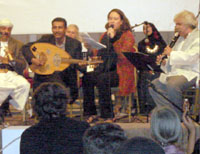 French and Yemeni musicians play music and sing at a concert in the garden of the French Cultural Center