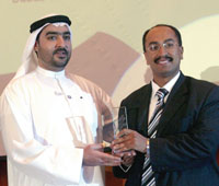 Walid Al-Saqqaf (right) receiving the AWA.