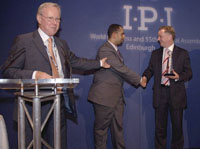 Receiving the award (from left): IPI Director John Fritz, Raidan Al-Saqqaf, member of YT board of directors, and Scotland